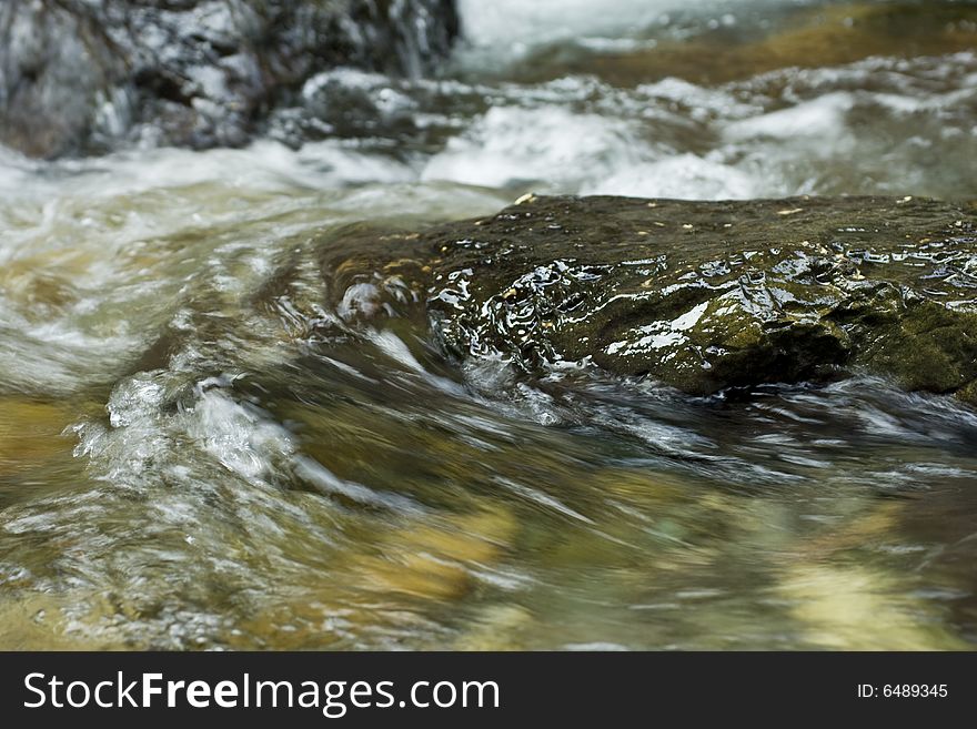 River flowing over a rock. River flowing over a rock