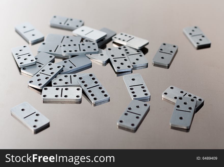 Steel dominoes on a polished surface