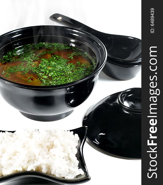 Japanese Soup in Black Dish. Isolated on White Background. Japanese Soup in Black Dish. Isolated on White Background