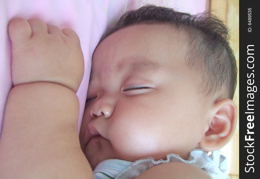 Sleeping Baby on a bed