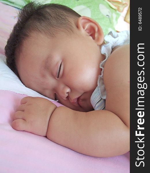 Sleeping Baby on a bed