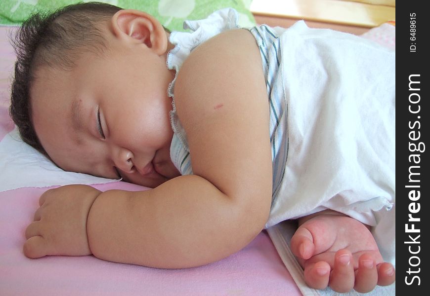 Sleeping Baby on a bed