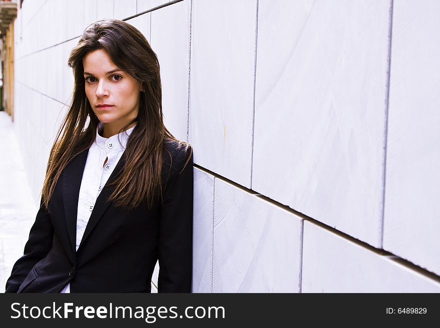 Long haired businesswoman staring at camera. Long haired businesswoman staring at camera.