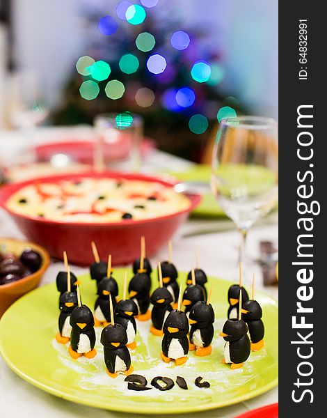 Cheese and olives handmade penguins sitting on a green plate, celebrating 2016. Enjoy!