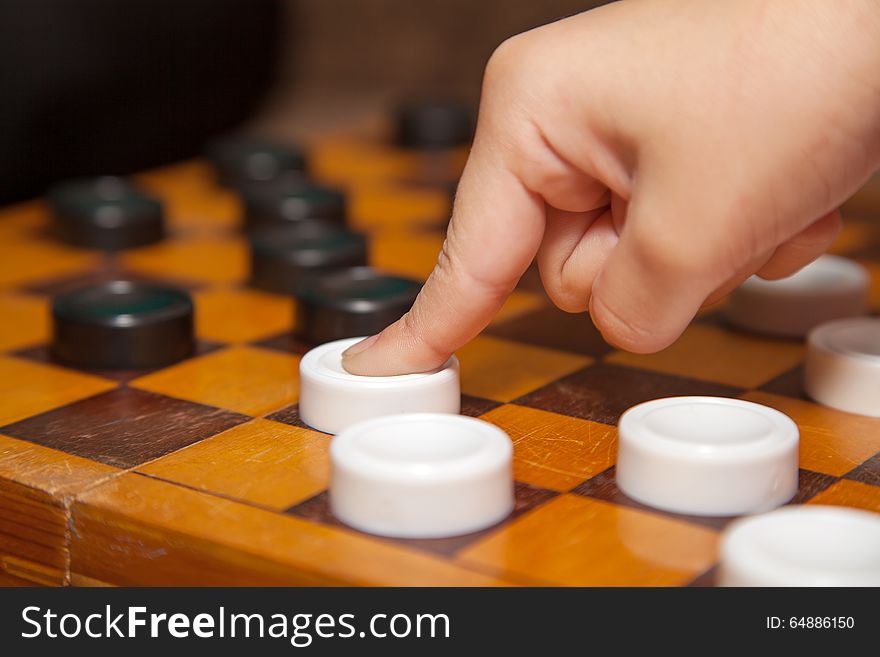 Finger Moves The Piece To The Chessboard