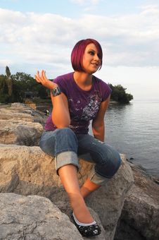 Girl Sitting On Lakeshore. Royalty Free Stock Photos Girl Sitting On Lakeshore. Royalty Free Stock Photos