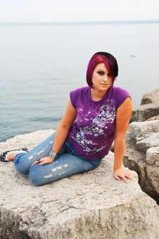 Girl Sitting On Lakeshore. Stock Image Girl Sitting On Lakeshore. Stock Image