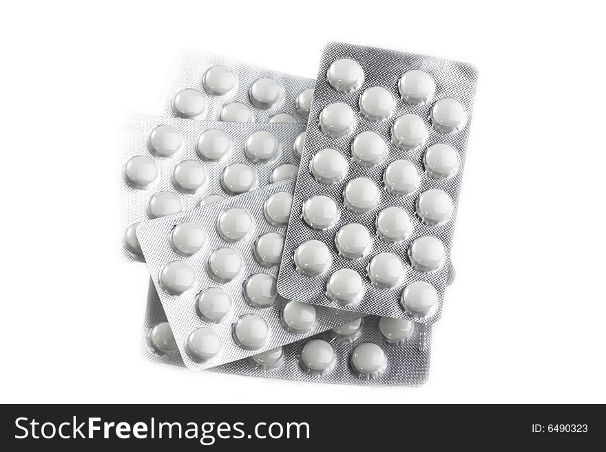 Pills in blister on white background