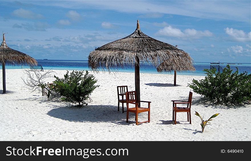 Chairs on the tropical beach. Chairs on the tropical beach