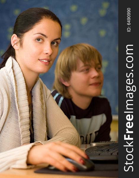 Two students are doing homework (focus on hand)