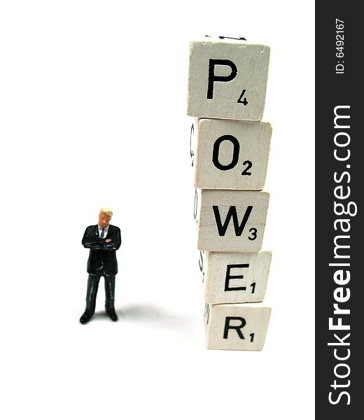 A man standing next to the word power