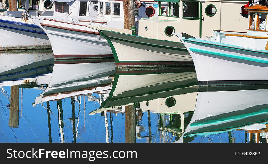 Boats reflection on the water in San Francisco marina. Boats reflection on the water in San Francisco marina.