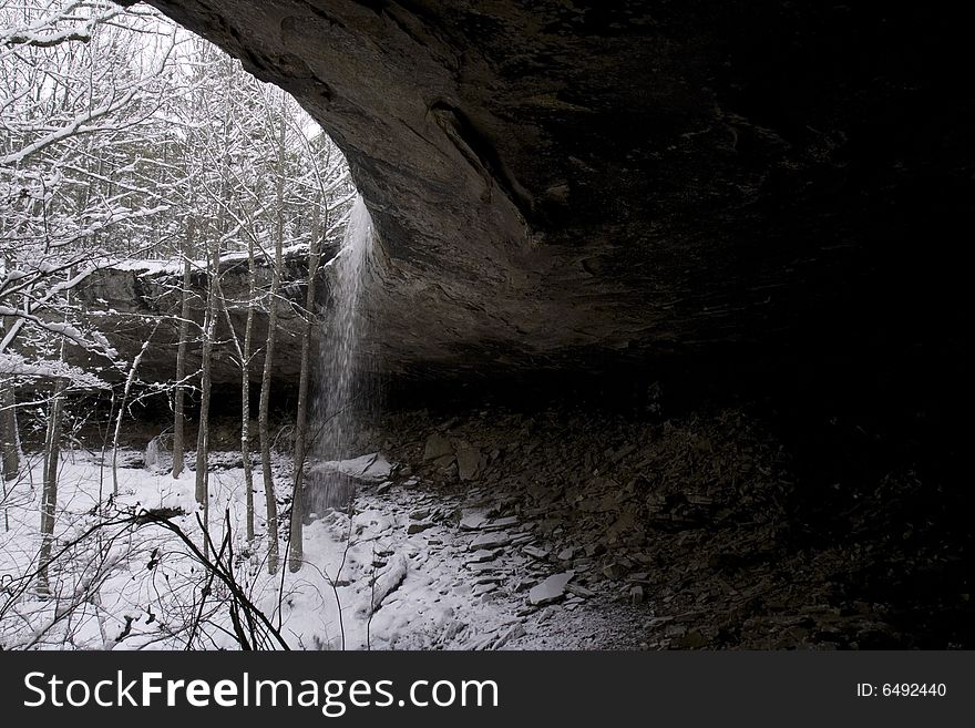 Image shot in the Ponca Wilderness Area of Arkansas with 8-10 inches of snow. Taken from inside the sweeping cave behind the waterfall at Hideout Hollow. Image shot in the Ponca Wilderness Area of Arkansas with 8-10 inches of snow. Taken from inside the sweeping cave behind the waterfall at Hideout Hollow.