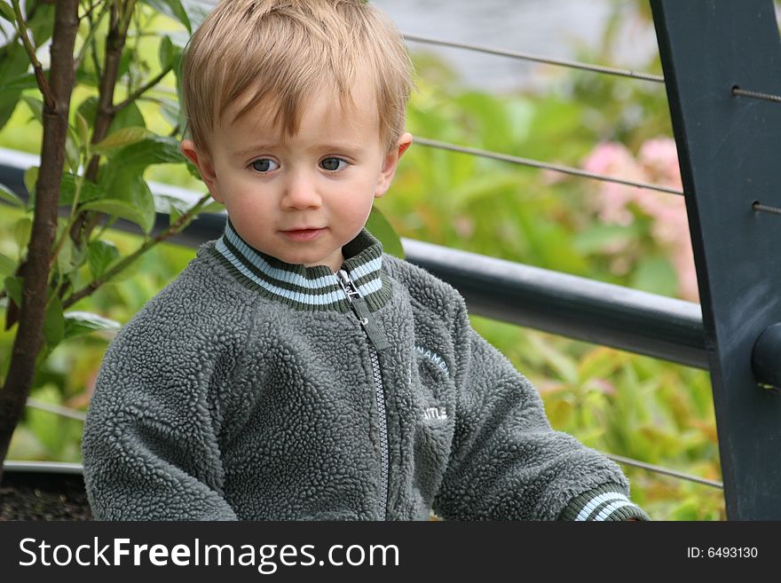 Small boy with a smiling face outdoor. Small boy with a smiling face outdoor