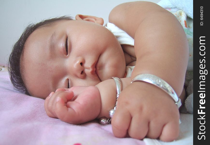 Sleeping Baby on a bed