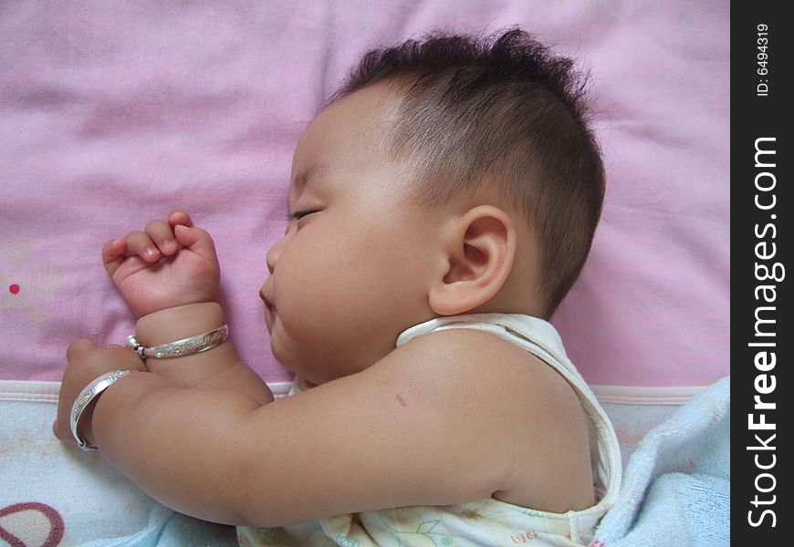 Sleeping Baby on a bed