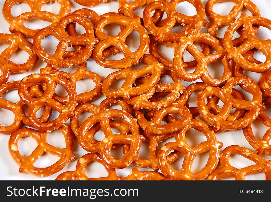 Golden brown twisty pretzels on white background. Golden brown twisty pretzels on white background