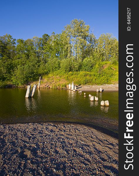 Remains of a pier, dock, or bridge over a river mouth on the North Shore of Lake Superior.