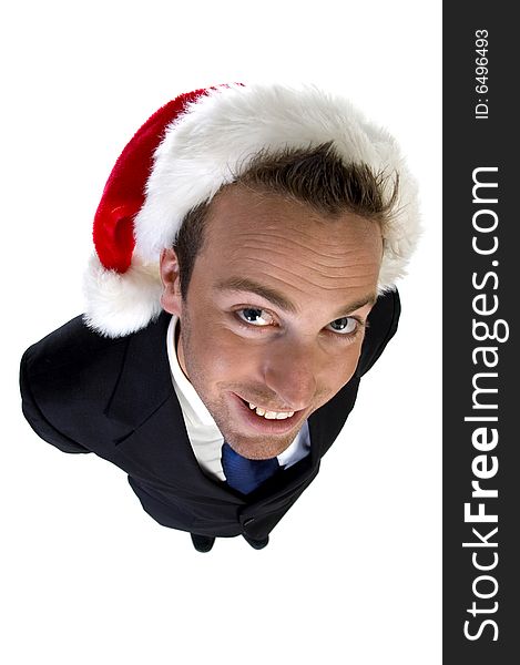 Posing businessman with christmas cap on white background