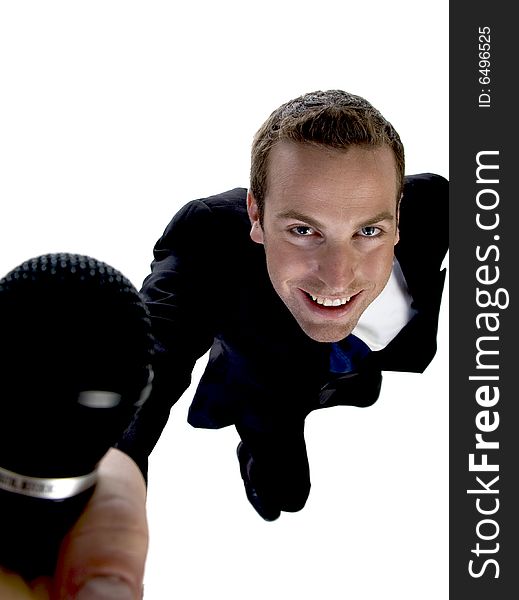 Businessman showing his mic on an isolated white background