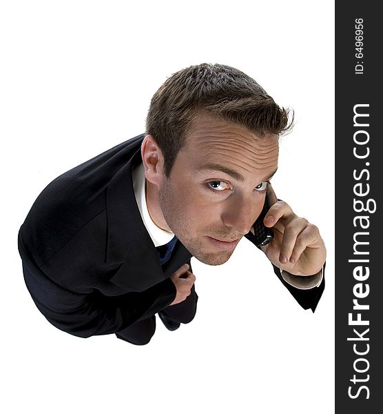 Businessman busy on phone call and looking upwards on an isolated white background