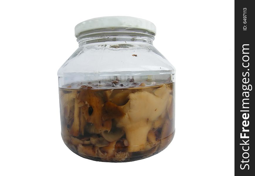 Glass jar of preserved mushrooms. Glass jar of preserved mushrooms