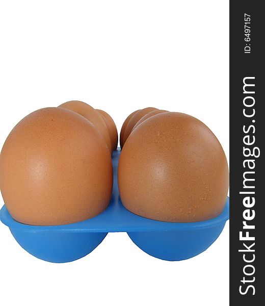 Eggs on a white background in a dark blue tray