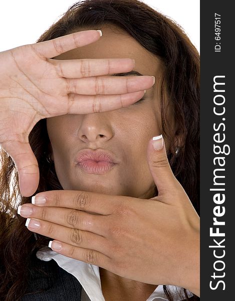 Closeup of female face with hand frame on an isolated background