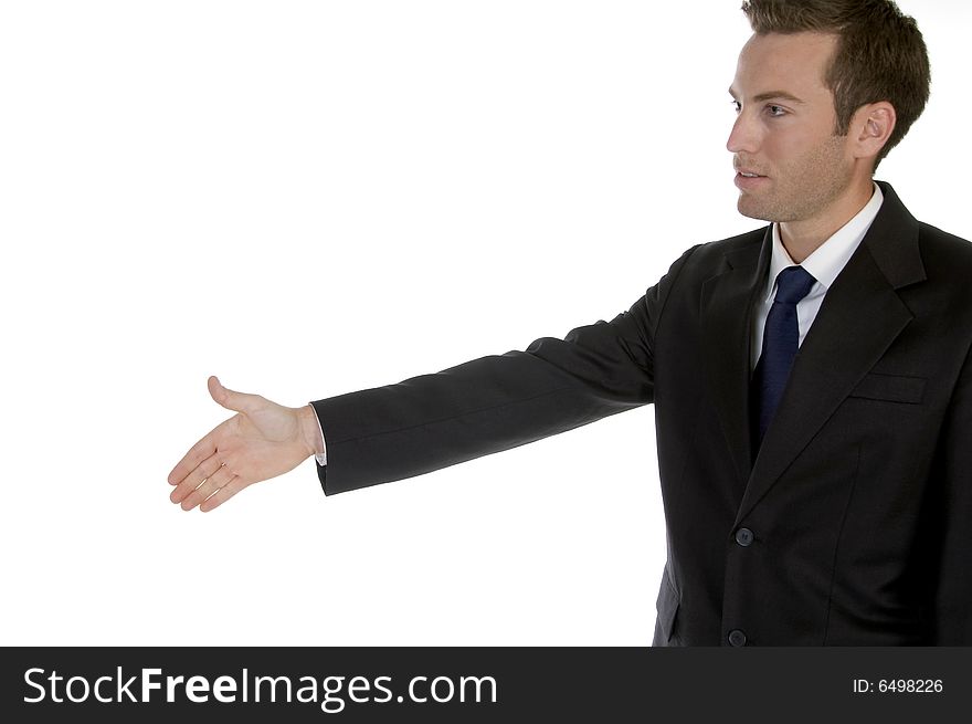 Young businessman offering handshake against white background