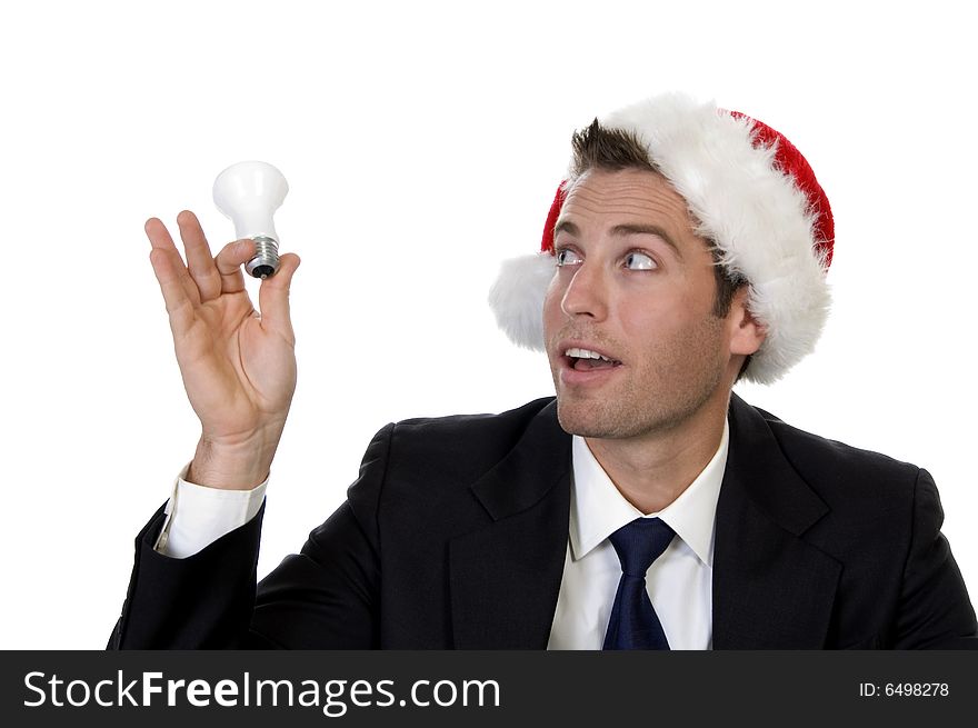 Businessman Looking Bulb And Wearing Santacap