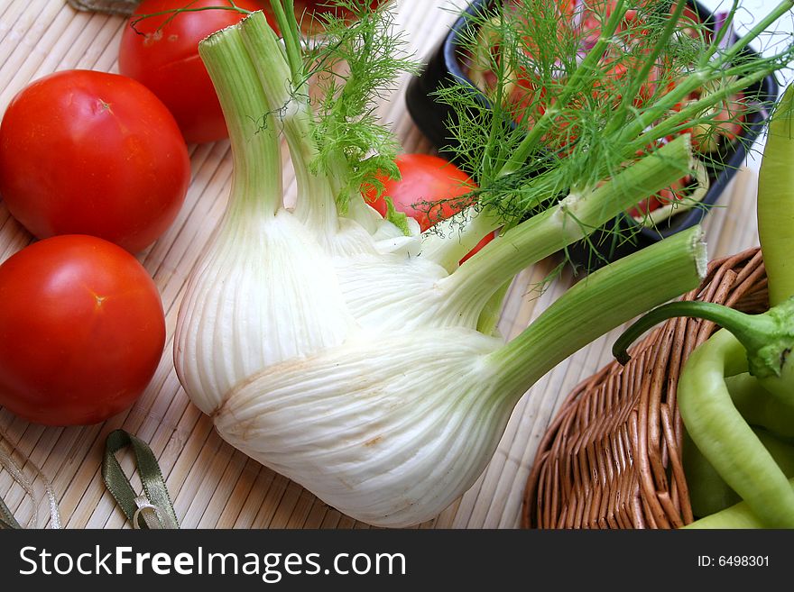 A fresh fennel and some red tomatoes