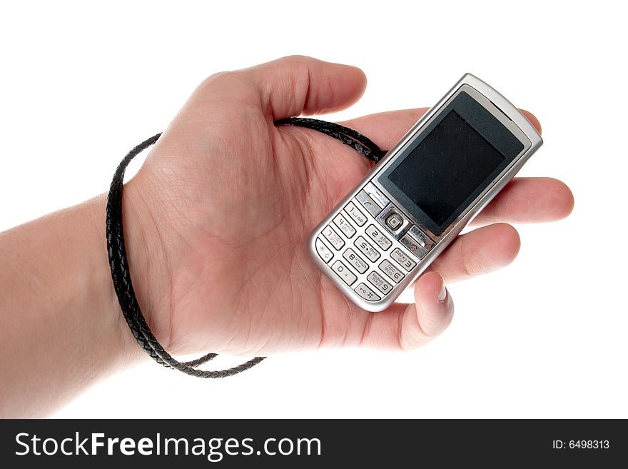 Small Silver Mobile Phone Device in hand. Small Silver Mobile Phone Device in hand