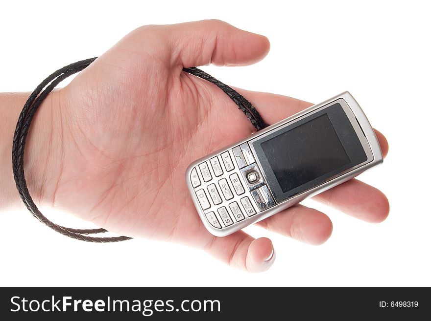Small Silver Mobile Phone Device in hand. Small Silver Mobile Phone Device in hand