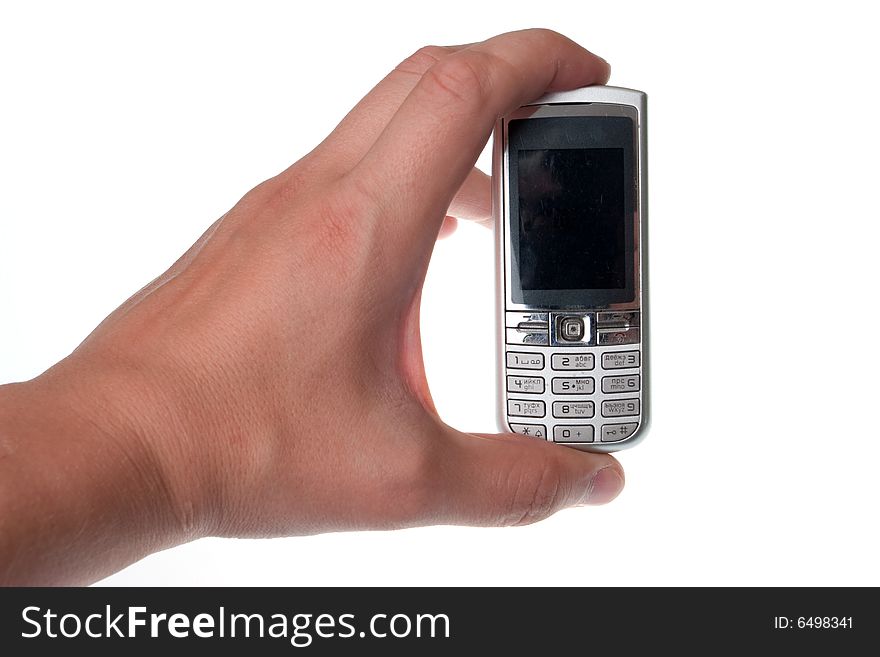 Small Silver Mobile Phone Device in hand. Small Silver Mobile Phone Device in hand