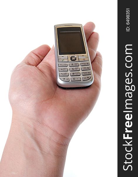 Small Silver Mobile Phone Device in hand. Small Silver Mobile Phone Device in hand