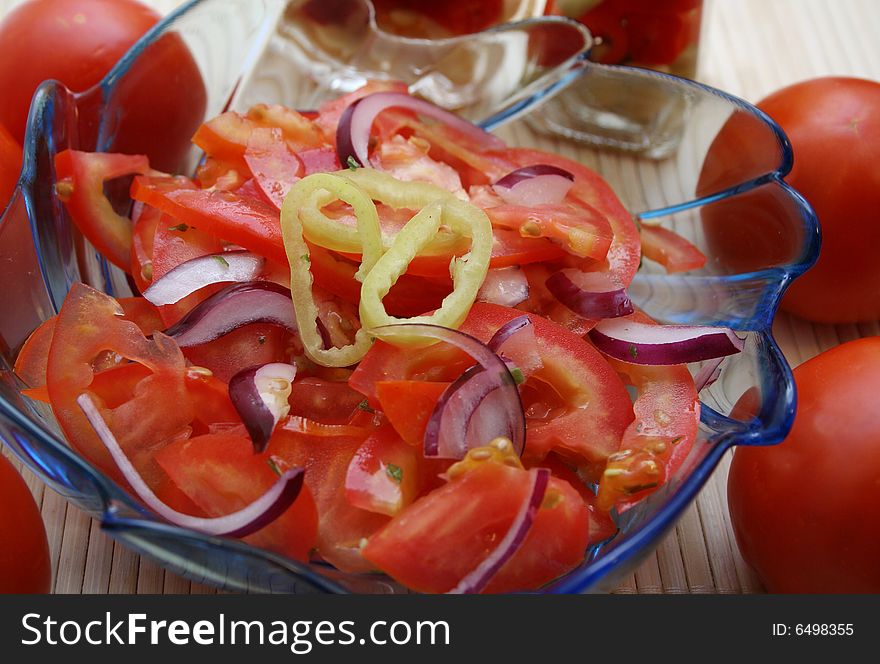 A fresh salad of tomatoes with red onions