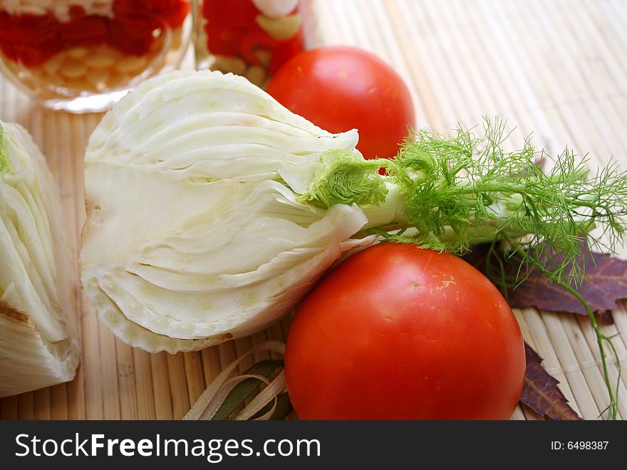 A fresh fennel and some red tomatoes