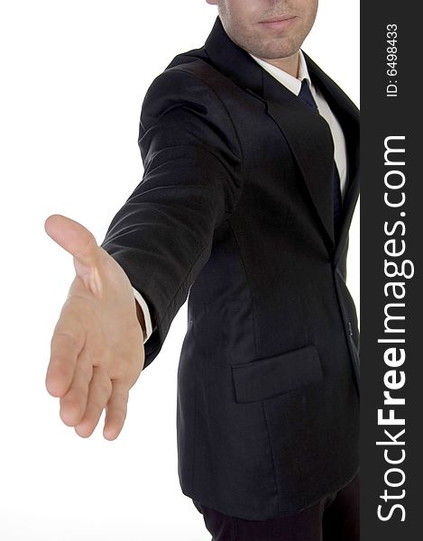Young man in suit offering to shake the hand on an isolated white background