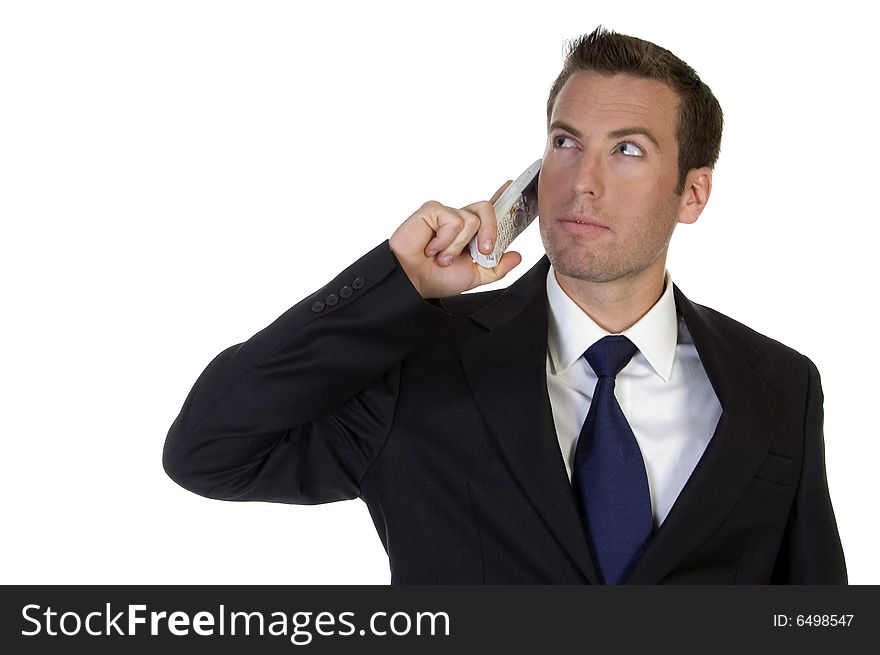 Portrait of young businessman with mobile against white background