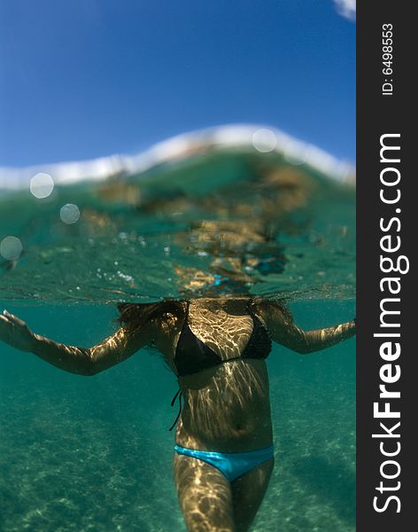 Girl standing in the beautiful clear water of Hawaii. Girl standing in the beautiful clear water of Hawaii