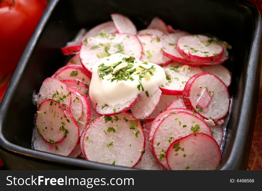 A salad of red radishes with some spices