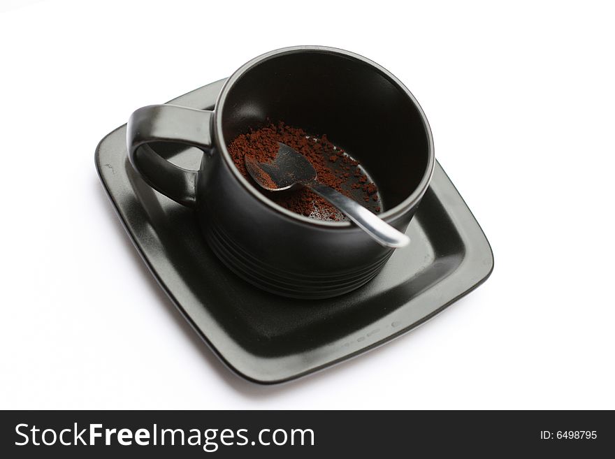 A cup of coffe without water against a white background.