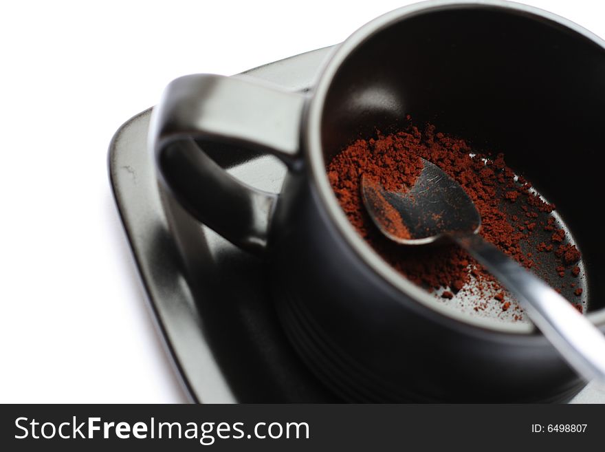 A cup of coffe without water against a white background.