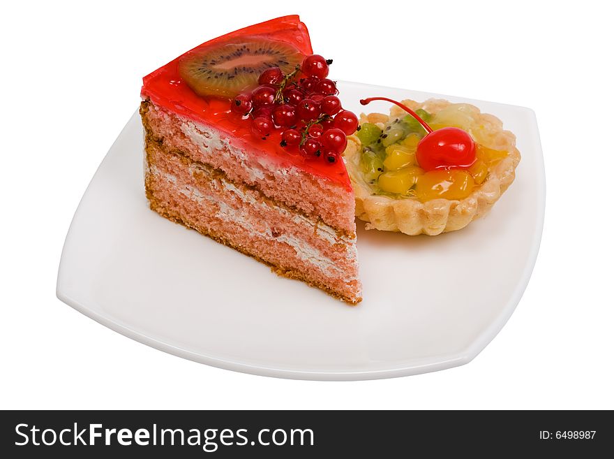 Sweet cakes with fruit on a white background