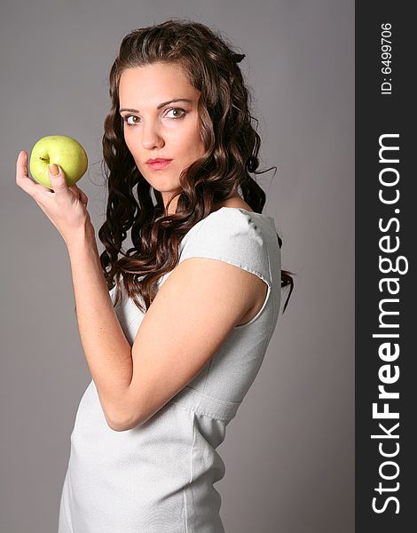 Young woman with green apple. Young woman with green apple