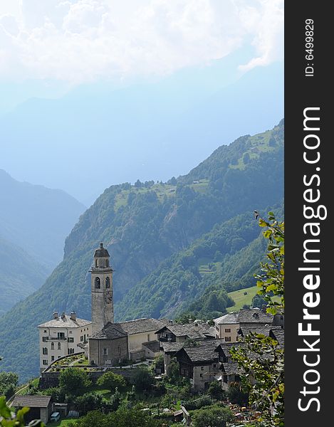 Lovely panorama in the alps in switzerland featuring an old church. Lovely panorama in the alps in switzerland featuring an old church