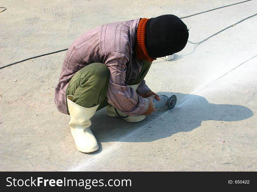 A man using grinder