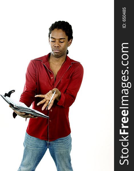 Young man with day planner set against white