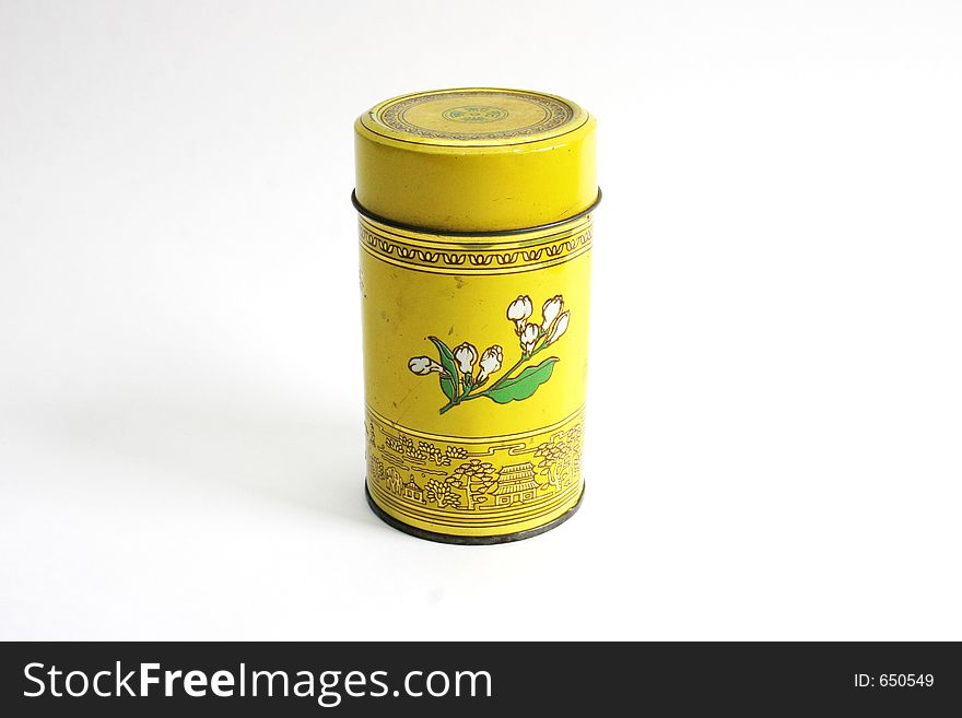 Old Chinese tea tin on bamboo - isolated. Old Chinese tea tin on bamboo - isolated