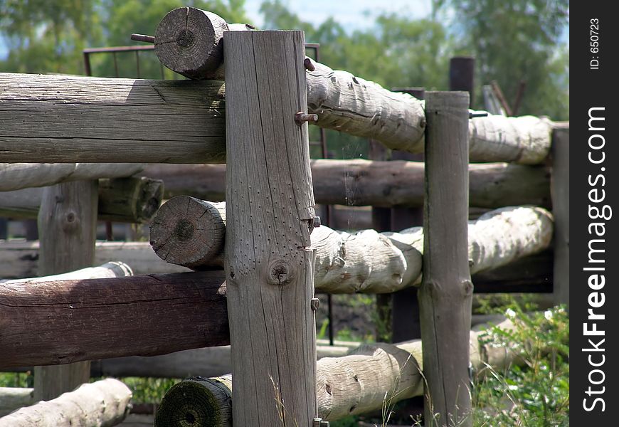 Wooden fence corner on a farm. Wooden fence corner on a farm